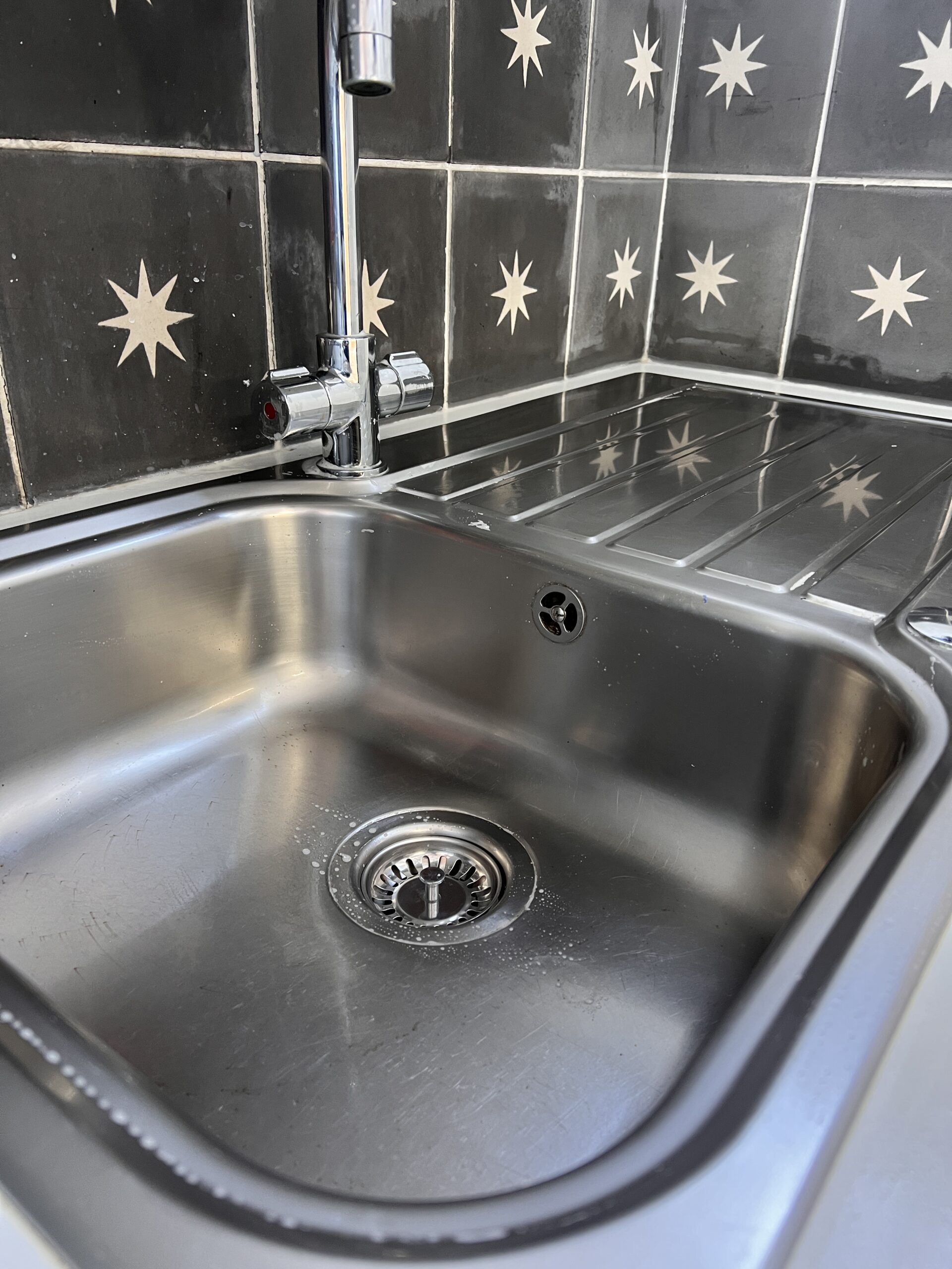 Stainless steel kitchen sink and drainer after cleaning by Clean & Co